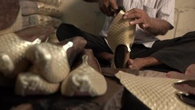 Close up of shoemaker putting cloth for making shoes . Shoemaker sews shoes. Designer cloth shoes. shoes for Indian wedding. Punjabi jutti making.shoe production.small shoe making business.