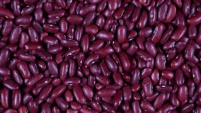 Scattered red beans are rotated on the table. High protein legumes,beans and lentils for healthy food.