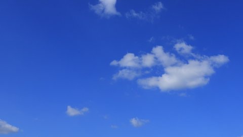 4k Blue sky white clouds. Puffy fluffy white clouds.Cumulus cloud cloudscape timelapse. Summer blue sky time lapse. Nature weather blue sky. White clouds background. Cloud time lapse nature background