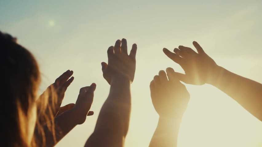 happy family people group pull hands to the sun teamwork. silhouette people party dancing recreation holiday. people at a music concert pull their hands up. religion concept sunlight lifestyle Royalty-Free Stock Footage #1062177724