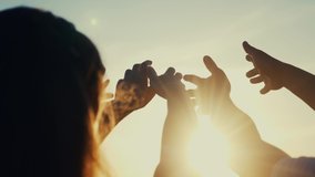 happy family people group pull hands to the sun teamwork. silhouette people party dancing recreation holiday. people at a music concert pull their hands up. religion concept sunlight lifestyle - Powered by Shutterstock - Get 15% off with code: PIKWIZARD15