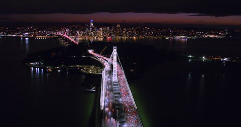 Amazing aerial view of the San Francisco Oakland Bay Bridge during rush hour, full of traffic. Night time. Interstate 80. California, USA. Shot on Red weapon 8K.