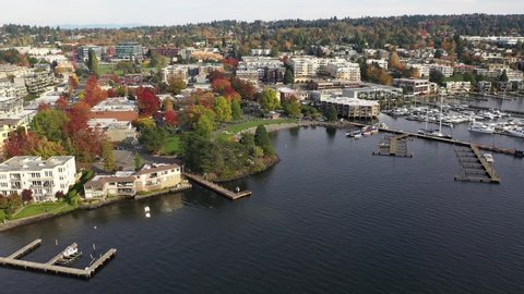 Aerial / drone footage of Kirkland downtown, marina and park, Moss Bay commercial and residential suburban neighborhood near Bellevue and Seattle, King County, Pacific Northwest Washington