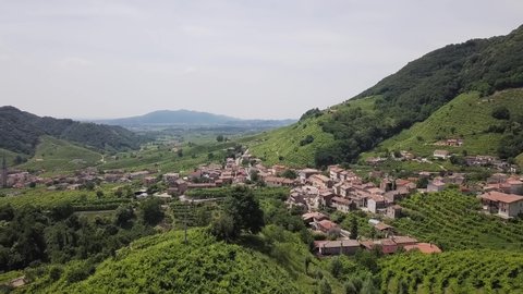 Drone shot of small Village in Veneto Wine region with surrounding Vineyards