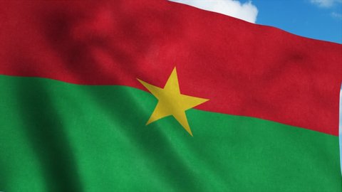 Burkina Faso flag waving in the wind, blue sky background. 4K