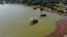 4k daytime drone aerial video looking over the famous Laguna de los Milagros in Tingo Maria (Gate of Amazon), Peru. Circular move around point of interest, pan left to right. Wide angle shot