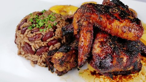 Chicken Wings Haitian and Caribbean food cooked by a chef. Exciting fusion cuisine in a restaurant.