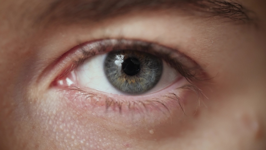 Extreme close up of Woman opening beautiful eye with blue iris. Attractive girl, a young female model with natural make-up and long eyelashes looking at camera. Slow-motion, macro, 4K. | Shutterstock HD Video #1062187807
