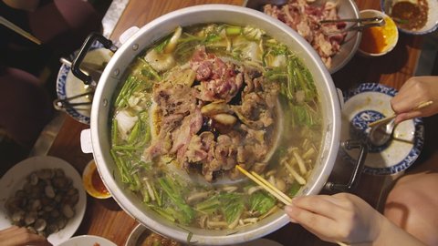 closeup famous asian street food bbg moo kata hot pot party enjoy eating dinner together with fun party and cheerful