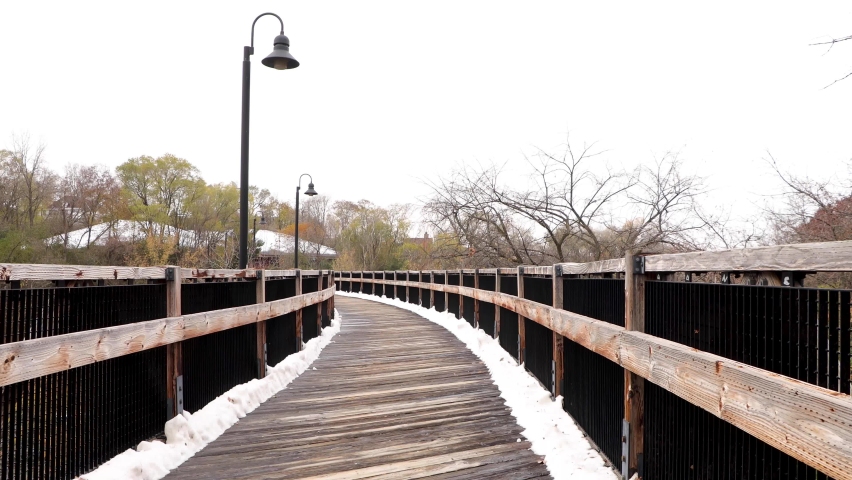 Wooden trail covered in snow. Wooden plank trail in Chippewa Falls State trail in Eau Claire, Wisconsin