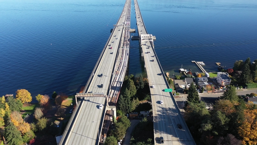 Aerial / drone footage of East side of Seattle, Mercer Island Town, Roanoke, the I-90 bridge, Lake Washington and surrounding suburbs, Lake Washington in King County, Washington
