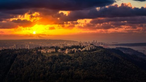 Cinemagraph Continuous Loop Animation. Aerial view of Burnaby Mountain during a vibrant sunset. Greater Vancouver, British Columbia, Canada. City viewed from Above. Dramatic Sky Artistic Render