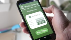 Using a mobile phone to pay for a bill using the online bank account. Banking online using a smartphone - Powered by Shutterstock - Get 15% off with code: PIKWIZARD15