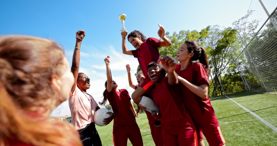 Group of female soccer players celebrating game victory with trophy Royalty-Free Stock Footage #1062206359