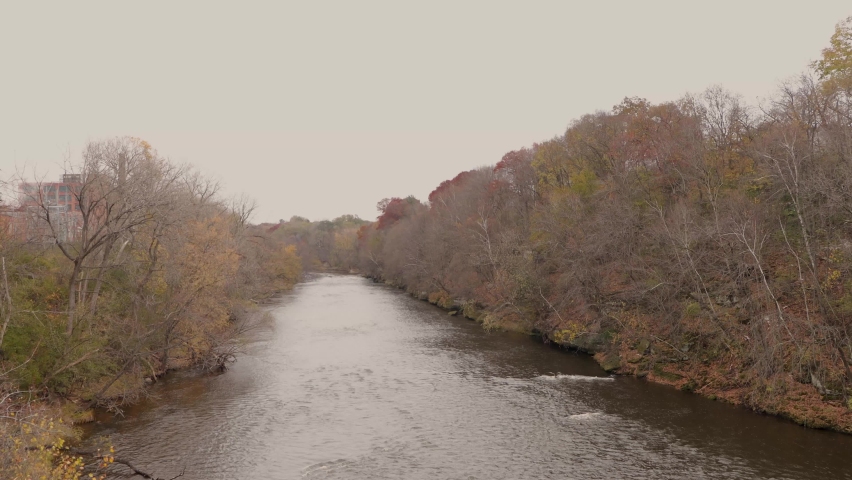 Fast flowing river surrounded by trees. Chippewa River in Eau Claire Wisconsin