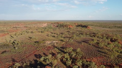 Aerial Footage of Australian Bushland with a Mine in the Background.
Location: Barkly Tableland, Northern Territory.