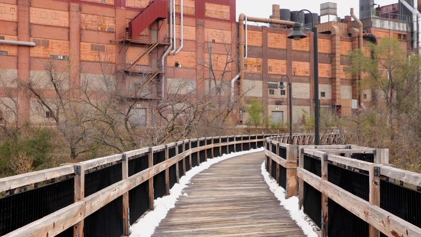 Wooden plank trail covered in snow. Chippewa Falls State Trail in Eau Claire Wisconsin