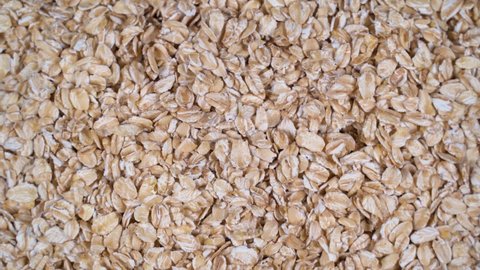 Scattered rolled oats are rotated on the table. High protein legumes,beans and lentils for healthy food.