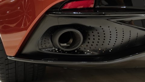 Close up of an exhaust pipe of a modern sports car. 