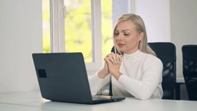 Millennial woman making video chat working from home using laptop. 
Business woman talking on video communication using laptop. Online training or distance work.