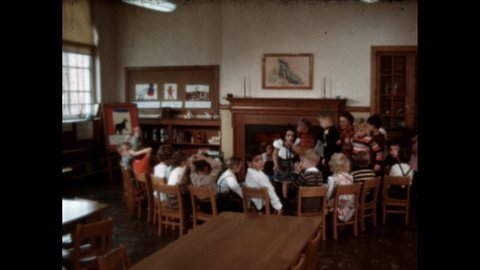 1960s: Students sit around fireplace. Students sit at desks, write. Students walk out of school buildings.
