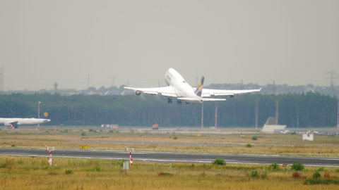 FRANKFURT AM MAIN, GERMANY - JULY 17, 2017: Lufthansa Boeing 747 airliner climbing in to the air after taking off from Frankfurt international airport.