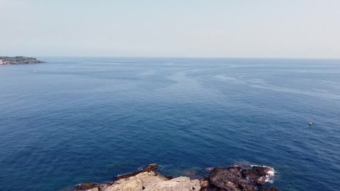 video drone Faraglioni di Acitrezza and Lachea island in the Ionian coast in Sicily