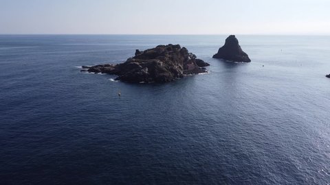 video shooting with drone from above towards Lachea island in Acitrezza in Sicily