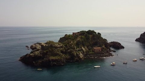 video with drone moving away from Lachea island in the Ionian coast in Sicily