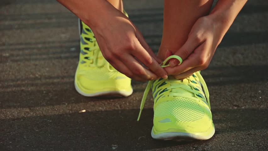 Slow Motion: Running Shoes. Barefoot 