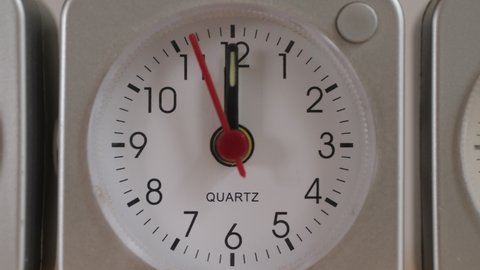 Seconds counting down to 12 o'clock, camera slides in to close up and focus. (quartz is a crystal, not a trademark!)