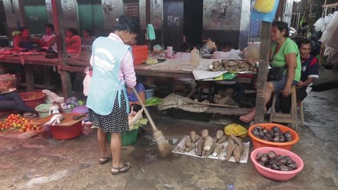 Peru. Iquitos. – April 15, 2019. exotic market. exotic market. Peruvian sweeping in the market. cleaning