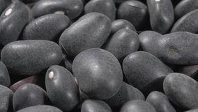Black beans close up. Macro. 4K video. Organic legumes.