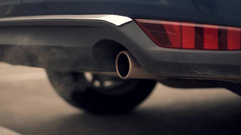 Air Pollution Smoke From Car Exhaust Pipe Muffler.Ecology Problem With Co2 Dioxide Emission. Gasoline Or Diesel Car Exhaust Fumes Pollution.Transport Tailpipe Muffler Smog.Eco Problem With Toxic Gases
