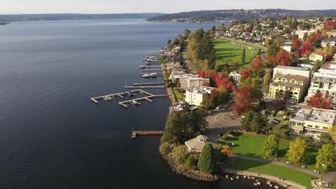 Aerial / drone footage of Kirkland, Heritage Park, Marina Park Pavilion, Moss Bay commercial and residential neighborhood, beach, near Bellevue and Seattle, King County, Pacific Northwest Washington