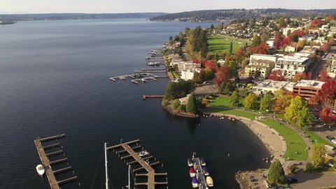 Aerial / drone footage of Kirkland, Norkirk, Market, Moss Bay commercial and residential suburban neighborhood, marina, beach park near Bellevue and Seattle, King County, Pacific Northwest Washington