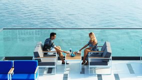 couple is drinking coffee on the terrace of the sea hotel. - Powered by Shutterstock - Get 15% off with code: PIKWIZARD15