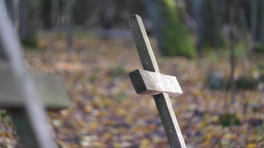 Old Wooden Crucifix on Forgotten Grave in Cemetery Deep in the Woods | Shutterstock HD Video #1062280564
