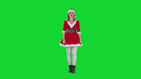 Attentive Santa girl listen with crossed hands and head nod approval. Full body on chroma key green screen. 