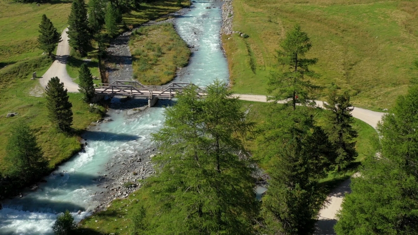 An aerial view over Val Roseg - San Moritz - Engadina - wooden bridge