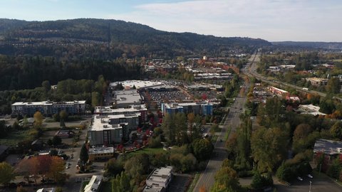 Birdseye footage of Issaquah, Olde Town, Montreaux, Tibbetts Creek Valley, Cougar Mountain, the I-90 highway, commercial area, Lake Sammamish and surrounding suburbs in King County, Washington