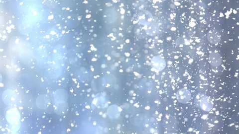 Super Slow Motion Shot of Real Snow Falling on Blue Christmas Background.