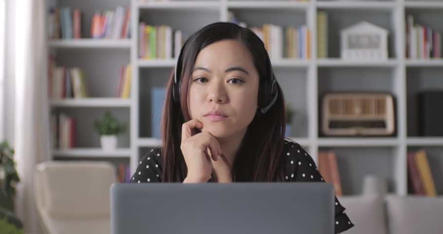 asian chinese woman conference video call webinar distance working,frontal view young female talking at computer webcam tutor application job Royalty-Free Stock Footage #1062294550