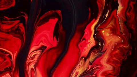 Fluid art painting video, trendy acryl texture with flowing effect. Liquid paint mixing backdrop with splash and swirl. Detailed background motion with red, black and yellow overflowing colors.