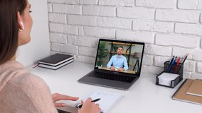 Emotional woman study at home office online by conference video call laptop communicates talk speak teacher. Man tutor in computer screen listen student by remote webcam, distance education learning