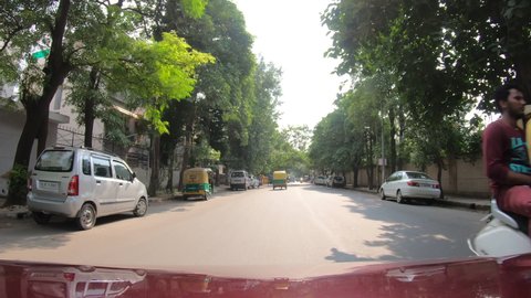 Car pov, traffic in New Delhi, India