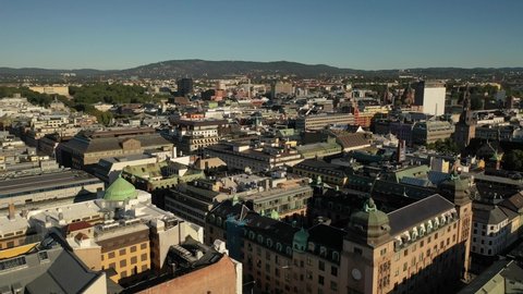 Oslo, Norway. Beautiful 4K panoramic aerial video from flying drone to Oslo city center. Against the background of the mountains and blue sky on a sunny summer day. (Series)