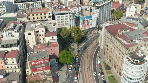 City Streets of Istanbul Tilt up to reveal Galata Tower in Taksim on Sunny Day, Aerial wide establishing shot, Istanbul, Turkey on September 17th 2020