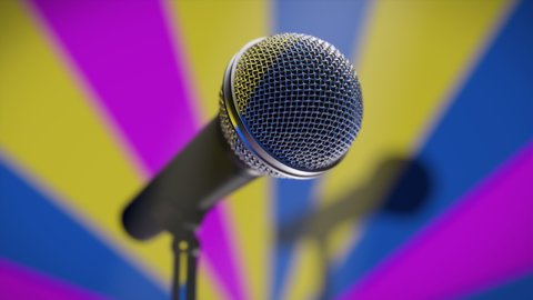 Music microphone on the stage of a disco bar, nightclub, karaoke bar or entertainment talk show on a colorful retro background. Stage lights spotlights illuminate scene in the 80's 90's style, loop.