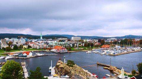 Kristiansand, Norway. Aerial view of the city. Time-lapse during the cloudy day in autumn of Kristiansand, Norway, zoom in